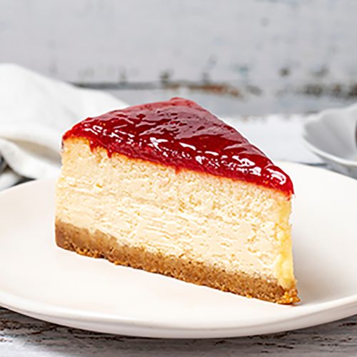 Cheesecake. New York cake. Raspberry cheesecake on wood floor background. close up